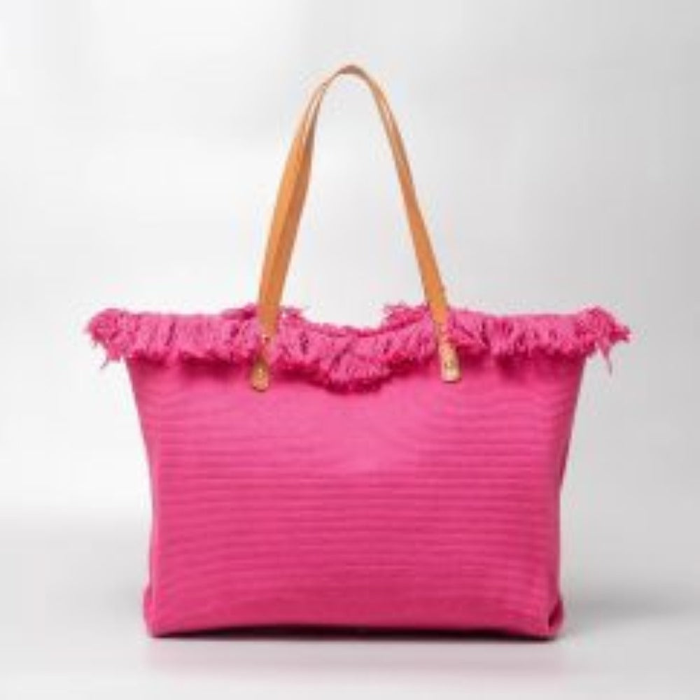Fuchsia This spacious tote bag features a finely textured main body adorned with an eye-catching, voluminous fringe trim entirely wrapping around the upper opening. Designed for versatile everyday use, the bag is equipped with dual flat shoulder straps anchored securely to the front and back panels by metallic rivets.