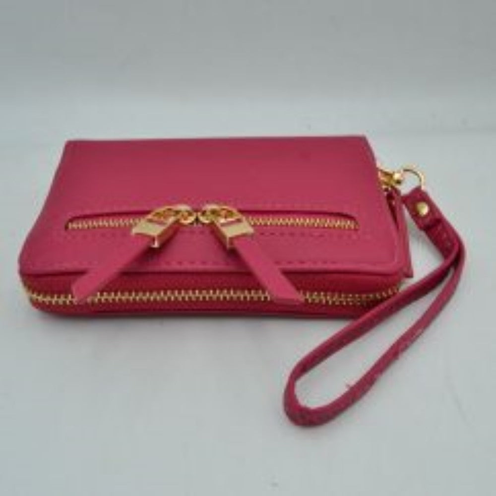 Fucjsia This practical everyday wallet clutch features a structured rectangular design equipped with multiple storage compartments to keep your essentials organized. It includes a secure main wrap-around zipper closure alongside a distinct dual-zipper front accent pocket featuring metallic pulls with extended tabs. Designed for effortless hands-free carrying, it comes with a detachable, textured wristlet strap connected by a metallic clasp, combining convenience and contemporary style for daily use.