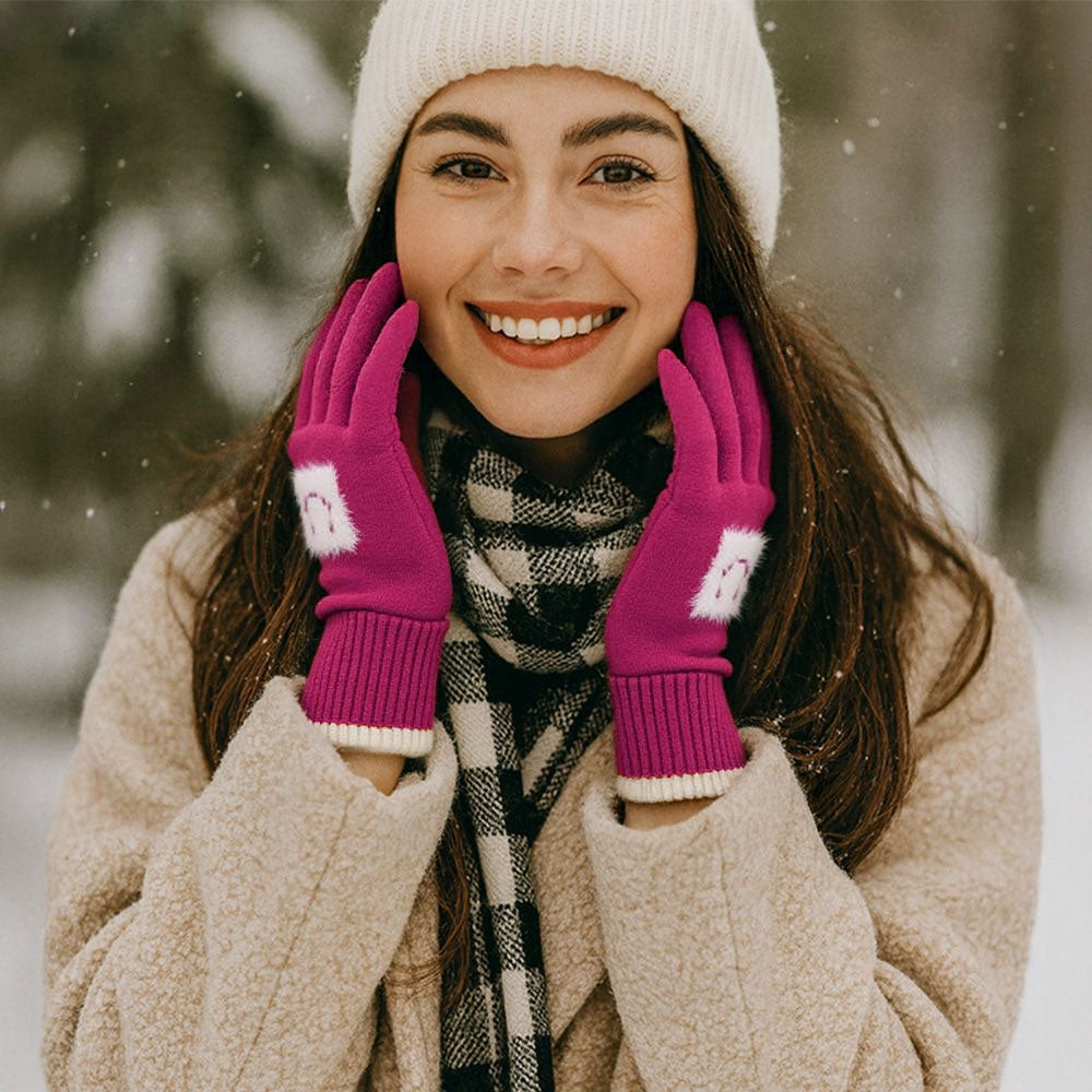Fuchsia Cozy knit gloves with smart touch technology, featuring a playful face motif and contrast trim design. Perfect for keeping hands warm while allowing easy use of smartphones and tablets. A stylish and practical cold-weather accessory that combines fun detailing with everyday functionality.