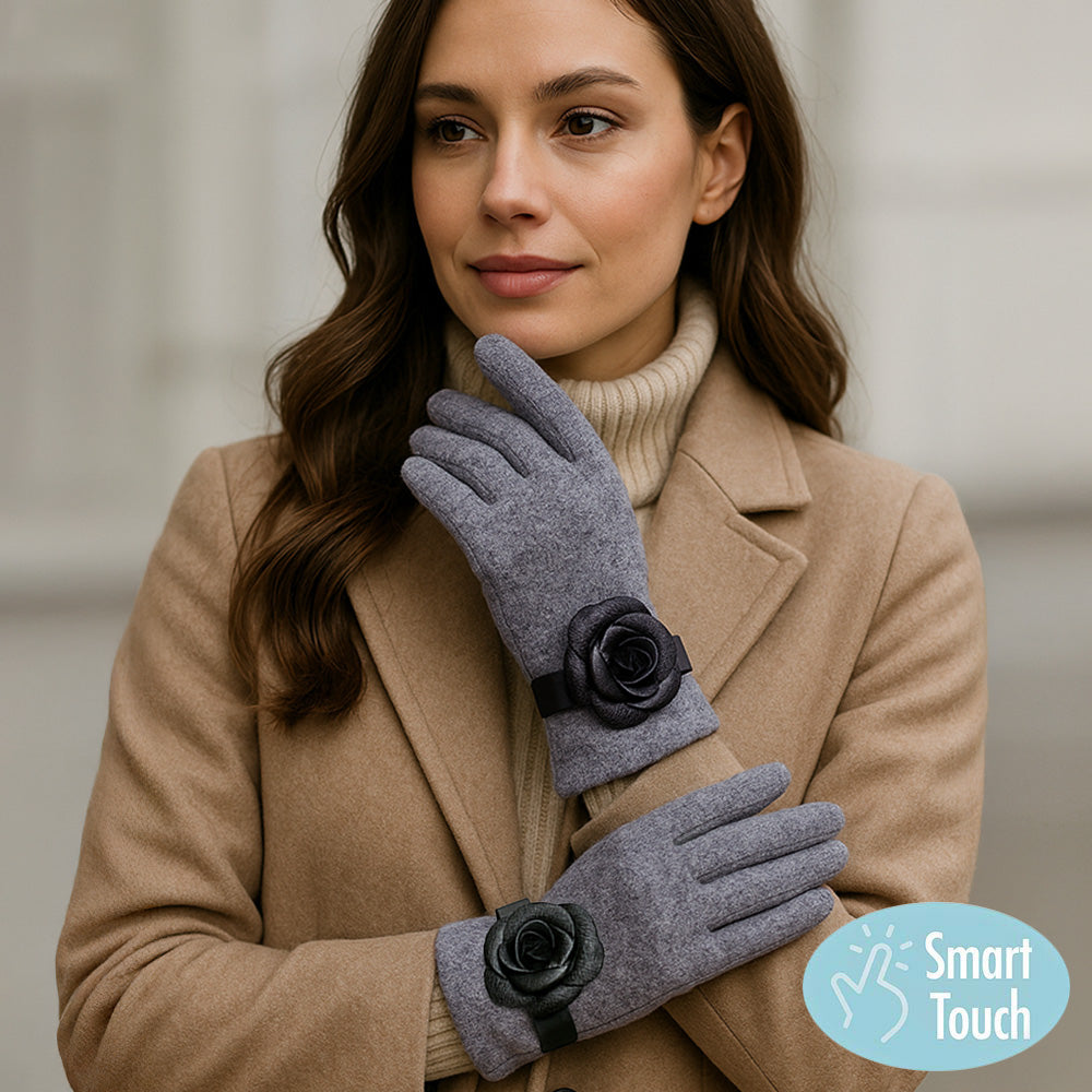 Gray Chic gloves featuring a statement flower accent, combining fashion-forward design with everyday practicality. Made with smart touch technology for effortless phone and tablet use, these gloves keep hands warm while adding elegance and feminine charm to any winter outfit, casual or dressy.