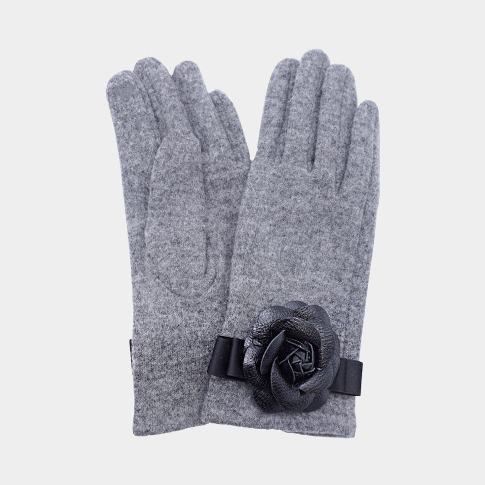 Gray Chic gloves featuring a statement flower accent, combining fashion-forward design with everyday practicality. Made with smart touch technology for effortless phone and tablet use, these gloves keep hands warm while adding elegance and feminine charm to any winter outfit, casual or dressy.