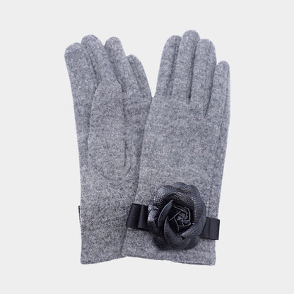 Gray Chic gloves featuring a statement flower accent, combining fashion-forward design with everyday practicality. Made with smart touch technology for effortless phone and tablet use, these gloves keep hands warm while adding elegance and feminine charm to any winter outfit, casual or dressy.