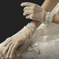 White Refined gloves adorned with clustered pearl accents at the cuff, ideal for formal events, bridal wear, or vintage-inspired looks. These elegant accessories provide a sophisticated finish to your outfit.