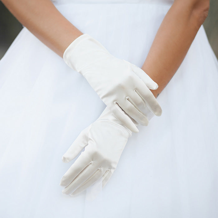 Ivory Dressy Satin Wedding Gloves are designed to add a touch of sophistication and style to any wedding attire. Made with high-quality satin fabric, they are comfortable to wear and provide a perfect fit. Enhance your wedding look with these chic gloves.