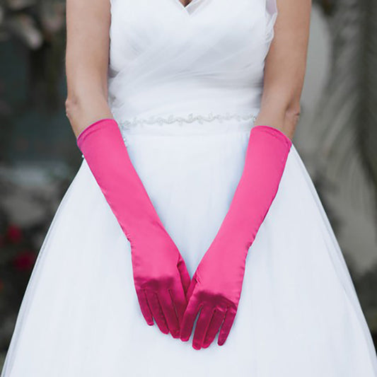 Fuchsia Medium Satin Wedding Gloves feature a smooth, lustrous finish that adds timeless elegance to bridal and formal ensembles. Designed for a comfortable mid-length fit, they provide a polished look while allowing ease of movement throughout your special occasion.