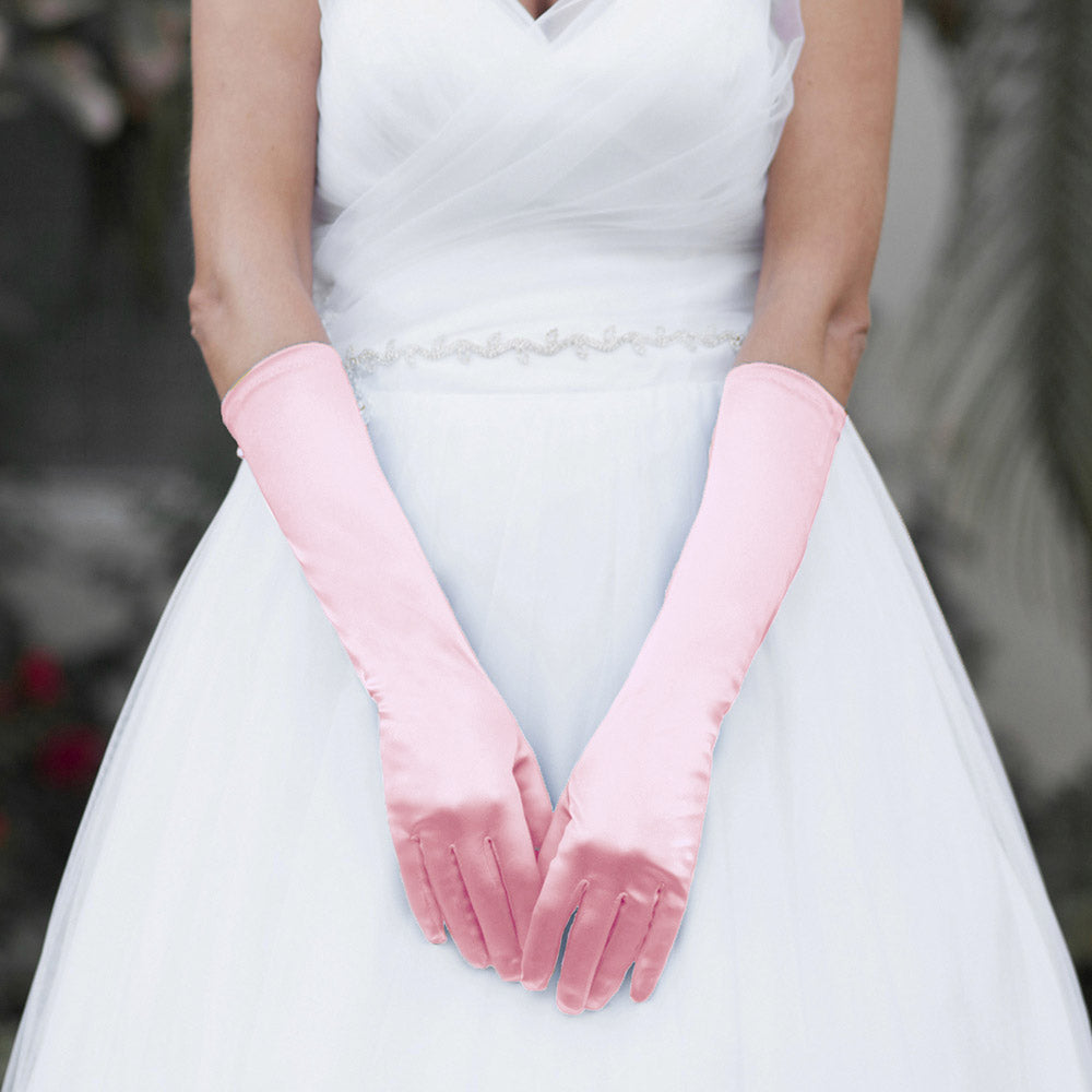 Pink Medium Satin Wedding Gloves feature a smooth, lustrous finish that adds timeless elegance to bridal and formal ensembles. Designed for a comfortable mid-length fit, they provide a polished look while allowing ease of movement throughout your special occasion.