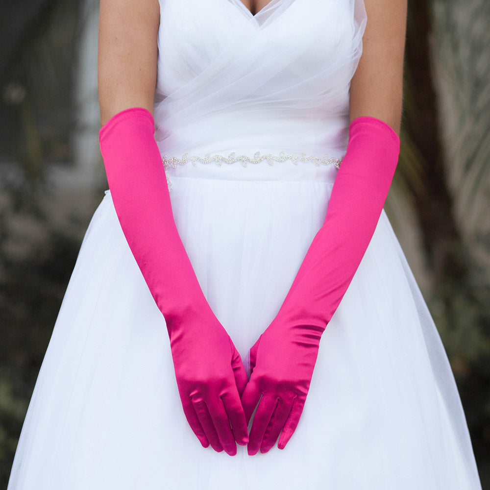 Fuchsia Dressy Satin Wedding chic Gloves are designed to add a touch of sophistication and style to any wedding attire. Made with high-quality satin fabric, they are comfortable to wear and provide a perfect fit. Enhance your wedding look with these chic gloves.