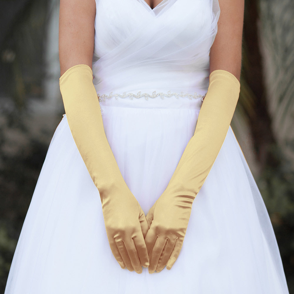 Gold &nbsp;Dressy Satin Wedding chic Gloves are designed to add a touch of sophistication and style to any wedding attire. Made with high-quality satin fabric, they are comfortable to wear and provide a perfect fit. Enhance your wedding look with these chic gloves.