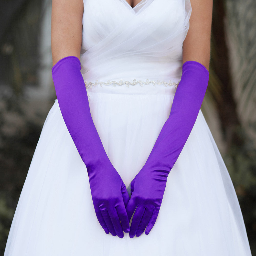 Purple Dressy Satin Wedding chic Gloves are designed to add a touch of sophistication and style to any wedding attire. Made with high-quality satin fabric, they are comfortable to wear and provide a perfect fit. Enhance your wedding look with these chic gloves.