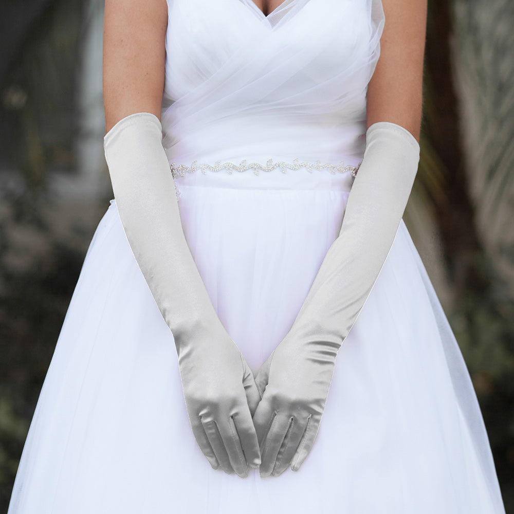Silver Dressy Satin Wedding chic Gloves are designed to add a touch of sophistication and style to any wedding attire. Made with high-quality satin fabric, they are comfortable to wear and provide a perfect fit. Enhance your wedding look with these chic gloves.