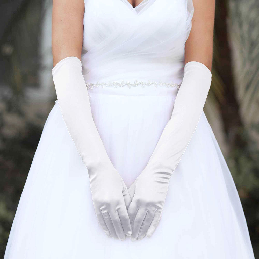 White Dressy Satin Wedding chic Gloves are designed to add a touch of sophistication and style to any wedding attire. Made with high-quality satin fabric, they are comfortable to wear and provide a perfect fit. Enhance your wedding look with these chic gloves.