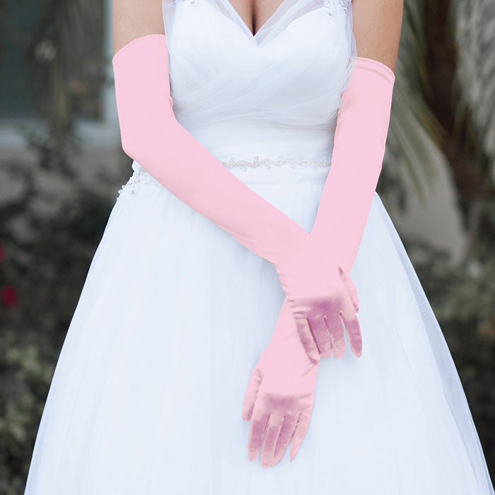 Pink Dressy Satin Long Wedding Gloves feature a smooth, lustrous finish that adds timeless elegance to bridal and formal ensembles. Designed for a comfortable long fit, they provide a polished look while allowing ease of movement throughout your special occasion.