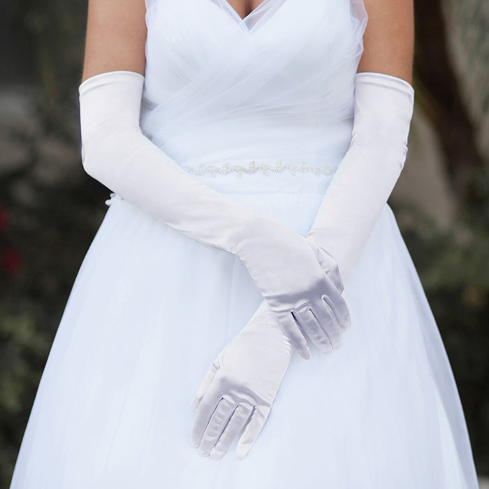 White Dressy Satin Long Wedding Gloves feature a smooth, lustrous finish that adds timeless elegance to bridal and formal ensembles. Designed for a comfortable long fit, they provide a polished look while allowing ease of movement throughout your special occasion.