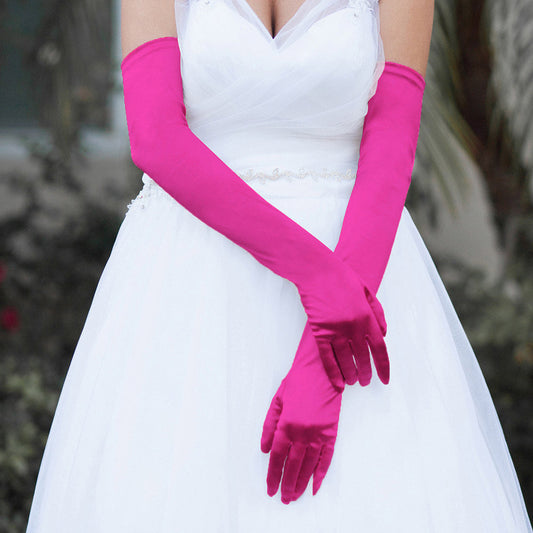 Fuchsia Dressy Satin Long Wedding Gloves feature a smooth, lustrous finish that adds timeless elegance to bridal and formal ensembles. Designed for a comfortable long fit, they provide a polished look while allowing ease of movement throughout your special occasion.
