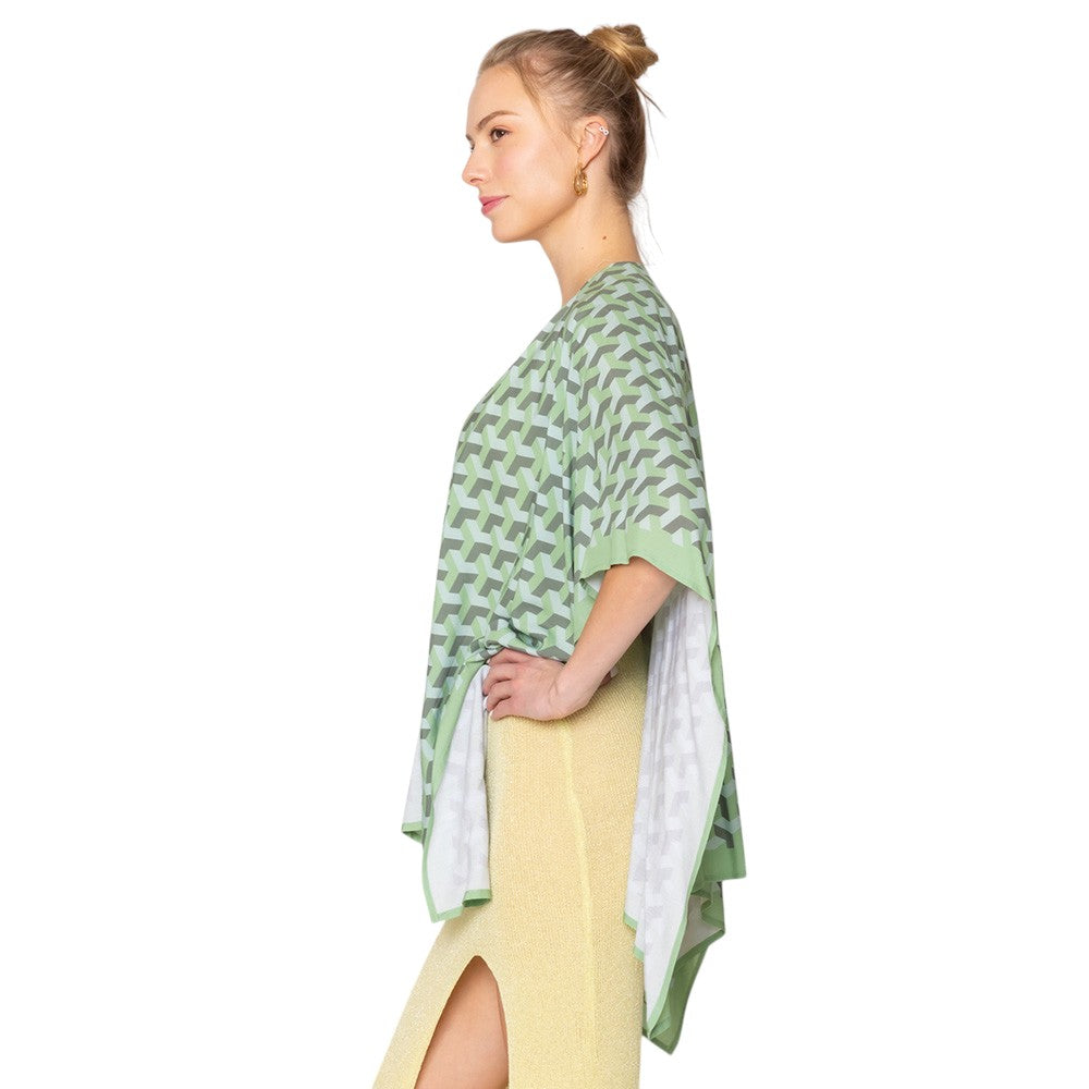 Green Geometric Pattern Print Ruana Poncho is a must-have addition to your wardrobe. Crafted with a unique geometric pattern, this poncho adds a touch of modern style to any outfit. Made with high-quality materials, it provides both comfort and durability. Perfect for any occasion, this versatile piece is a statement piece you won't miss out on. 