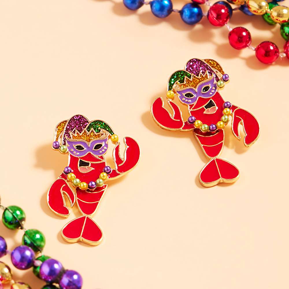 Glittered Enamel Mardi Gras Crawfish Earrings are a must-have for any festive celebration. Adorned with vibrant colors and sparkling glitter accents, these earrings add a playful touch to any outfit. The perfect accessory for Mardi Gras or any Louisiana-inspired event.