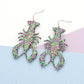 Glittered Mardi Gras Lobster Crawfish Dangle Earrings are the perfect accessory for any festive celebration. The glitter adds a touch of sparkle, while the lobster and crawfish design highlights your love for seafood and fun events. With their dangle style, these earrings are sure to catch everyone's attention.