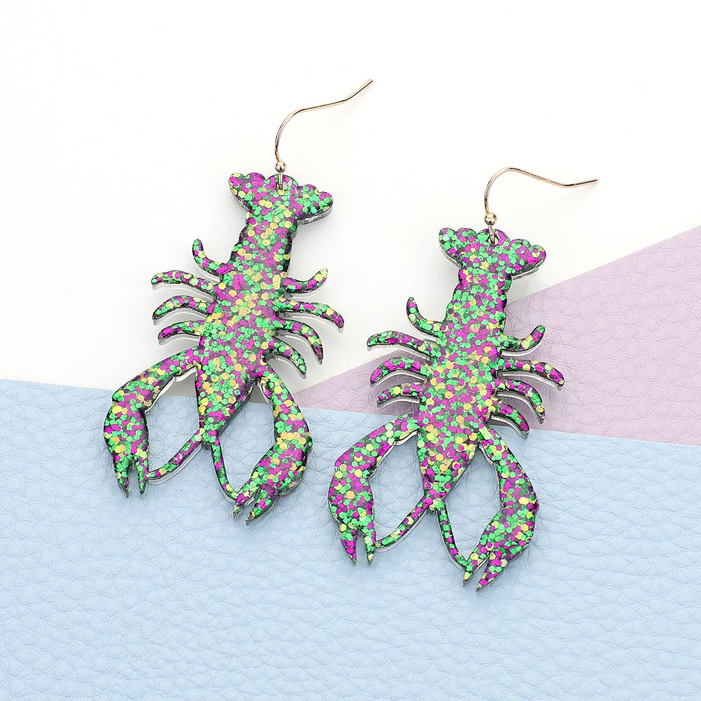 Glittered Mardi Gras Lobster Crawfish Dangle Earrings are the perfect accessory for any festive celebration. The glitter adds a touch of sparkle, while the lobster and crawfish design highlights your love for seafood and fun events. With their dangle style, these earrings are sure to catch everyone's attention.