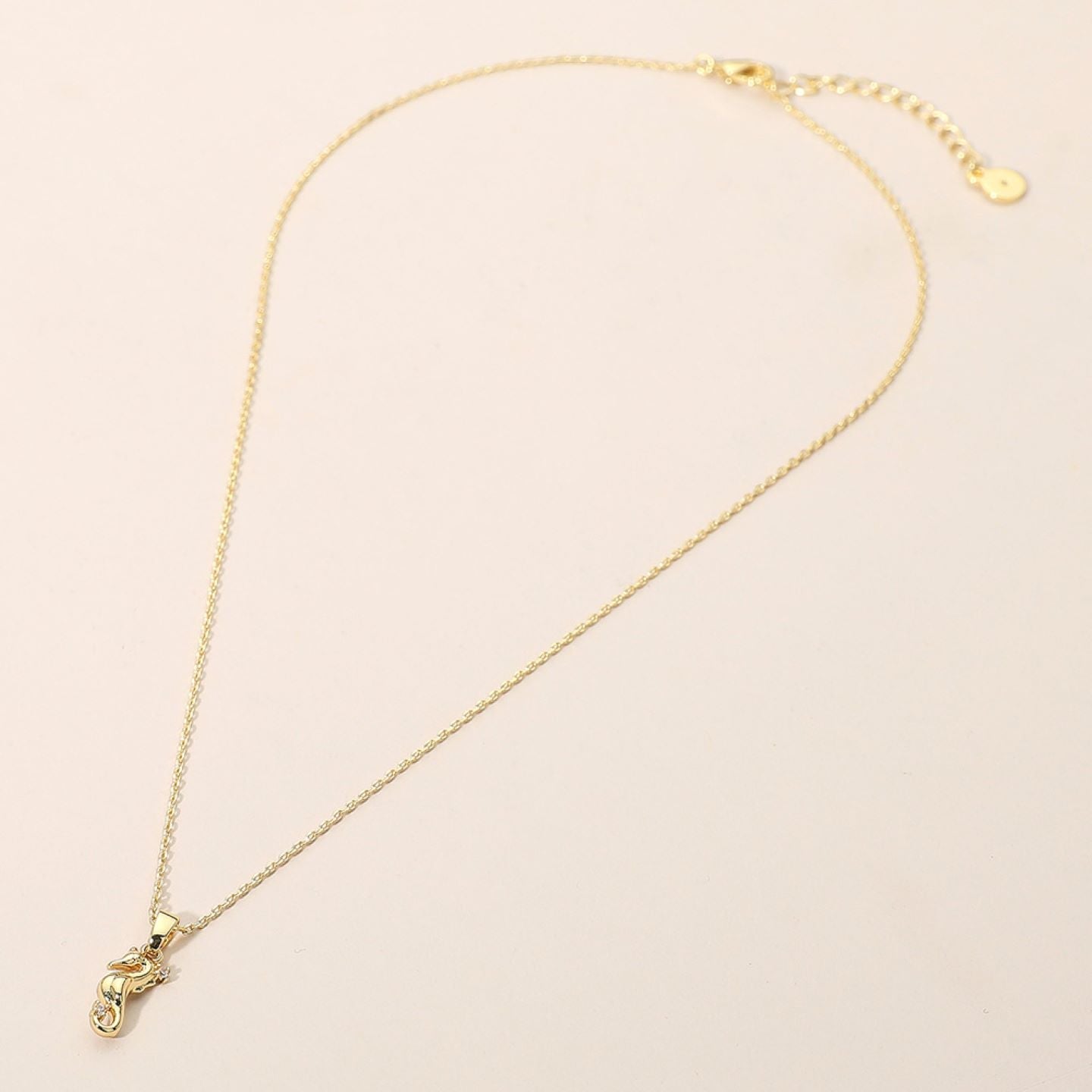 Bring warmth and charm to your jewelry collection with this playful holiday mitt pendant necklace. Embellished with sparkling details, it’s the perfect accessory for baking enthusiasts and those who love unique, whimsical designs that express creativity and personality.