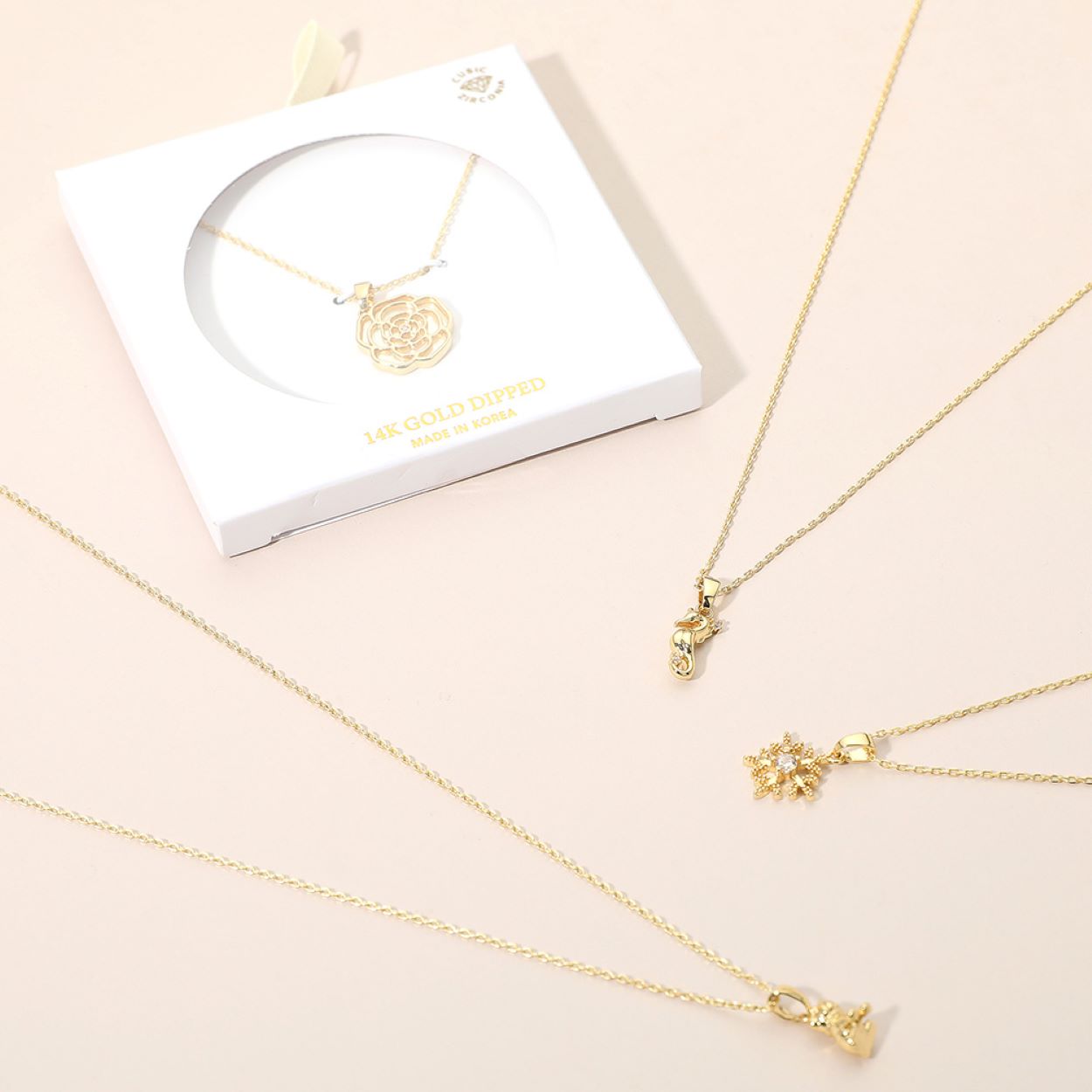 This reindeer pendant necklace is adorned with shimmering accents, capturing the charm and spirit of the season. A playful yet elegant design, it’s perfect for holiday celebrations or adding a touch of festive sparkle to your everyday jewelry collection.