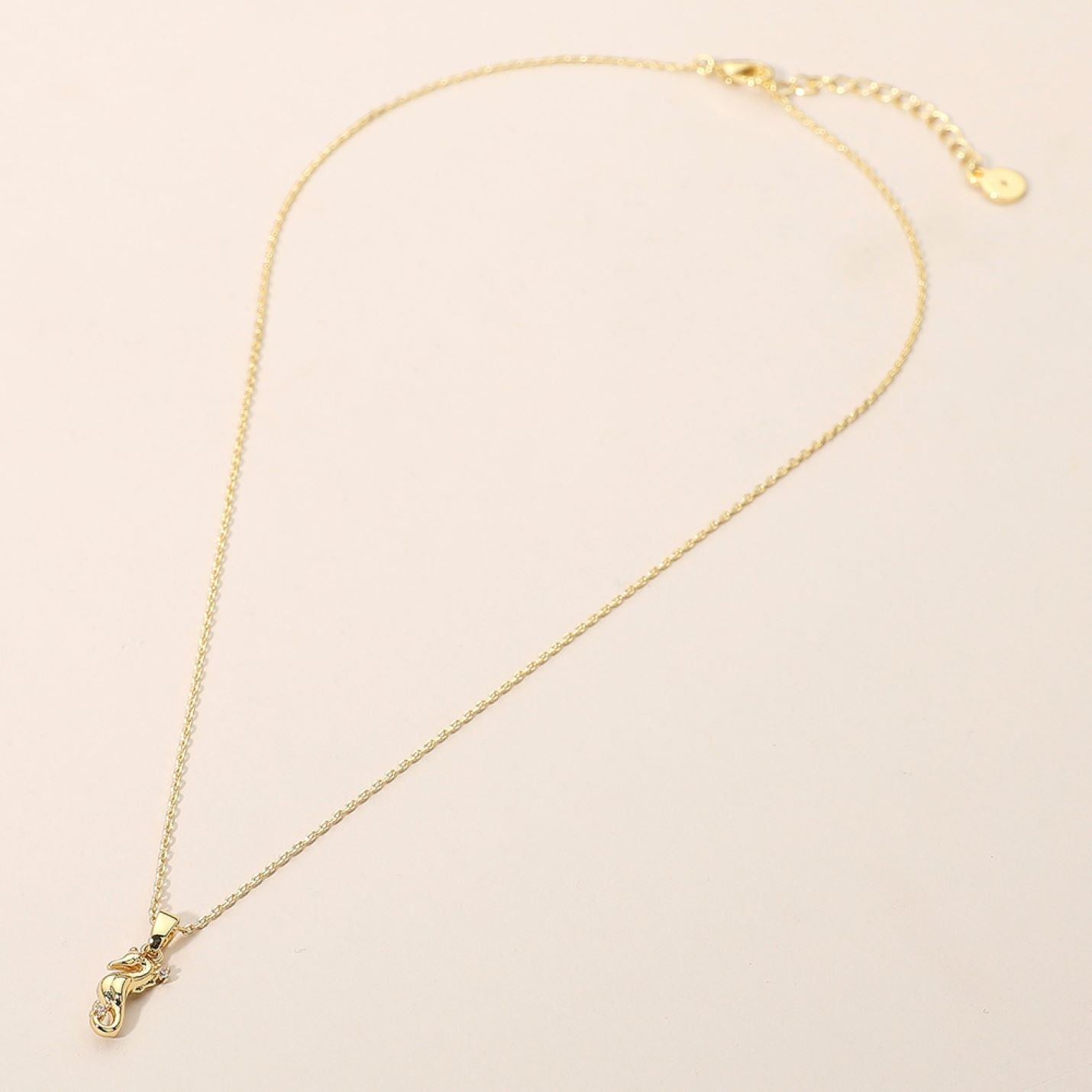 This reindeer pendant necklace is adorned with shimmering accents, capturing the charm and spirit of the season. A playful yet elegant design, it’s perfect for holiday celebrations or adding a touch of festive sparkle to your everyday jewelry collection.