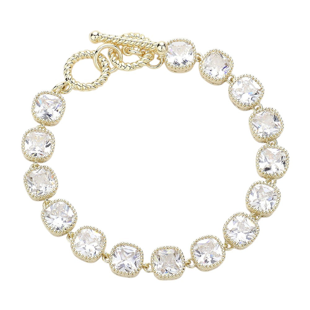 Gold 14K Gold Plated Square CZ Stone Link Evening Toggle Bracelet adds a touch of elegance to any outfit. The sparkling CZ stones and sturdy toggle clasp make it the perfect accessory for special occasions. Enjoy the luxurious look and feel of this high-quality bracelet