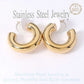 Gold 18K Gold Dipped Stainless Steel Chunky Hoop Earrings. Made with high-quality stainless steel and dipped in 18K gold, these earrings are durable and stylish. Add a touch of elegance to any outfit with these classic chunky hoops. Perfect for any occasion, these earrings are a must-have addition to your jewelry collection.