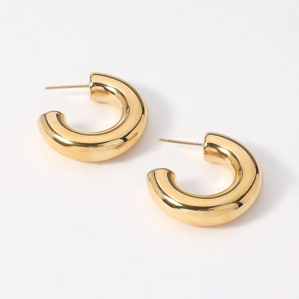 Gold 18K Gold Dipped Stainless Steel Chunky Hoop Earrings. Made with high-quality stainless steel and dipped in 18K gold, these earrings are durable and stylish. Add a touch of elegance to any outfit with these classic chunky hoops. Perfect for any occasion, these earrings are a must-have addition to your jewelry collection.