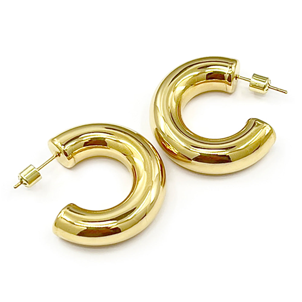 Gold 18K Gold Dipped Stainless Steel Chunky Hoop Earrings. Made with high-quality stainless steel and dipped in 18K gold, these earrings are durable and stylish. Add a touch of elegance to any outfit with these classic chunky hoops. Perfect for any occasion, these earrings are a must-have addition to your jewelry collection.