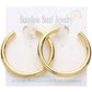 Gold 18K Gold Dipped Stainless Steel Hoop Earrings add a touch of elegance and durability to your everyday look. Made of high-quality stainless steel with gold plating, these earrings are both stylish and long-lasting. Elevate your style and make a lasting impression with these timeless hoop earrings.