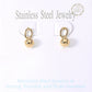 Gold 18K Gold Dipped Stainless Steel Mini Ball Dangle Earrings are expertly crafted to add a touch of elegance to any outfit. Made of high-quality materials, they offer a durable and long-lasting accessory that won't tarnish. The mini ball design gives a stylish and sophisticated look, perfect for any occasion.