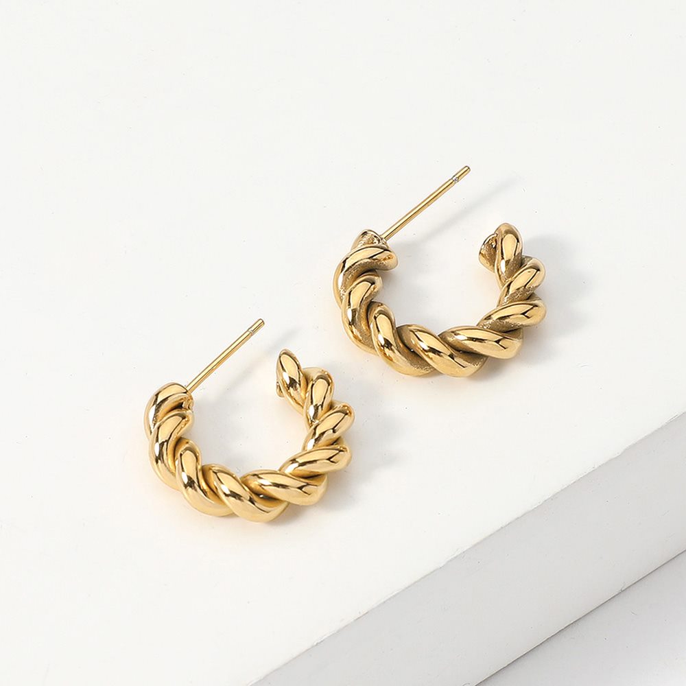 Gold 18K gold dipped stainless steel mini hoop earrings feature a unique twisted design, adding a touch of elegance to any outfit. The durable stainless steel material ensures long-lasting wear. Upgrade your jewellery collection with these stylish hoops.