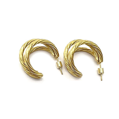 Gold 18K gold dipped stainless steel textured split hoop earrings offer a stylish and versatile addition to any outfit. With the durability and affordability of stainless steel, combined with the elegance of gold, these hoops are the perfect choice for everyday wear. The unique textured design adds a touch of sophistication to any look.