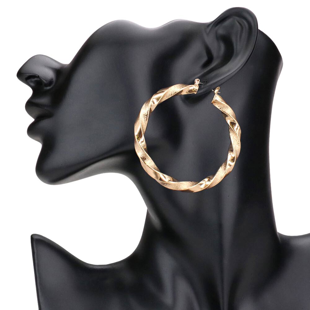 Gold 2.3 Inch Twisted Metal Hoop Pin Catch Earrings, turn your ears into a chic fashion statement with these twisted metal hoop earrings! The beautifully crafted design adds a gorgeous glow to any outfit. Put on a pop of color to complete your ensemble in perfect style. These adorable hoop pin catch earrings are bound to cause a smile. 