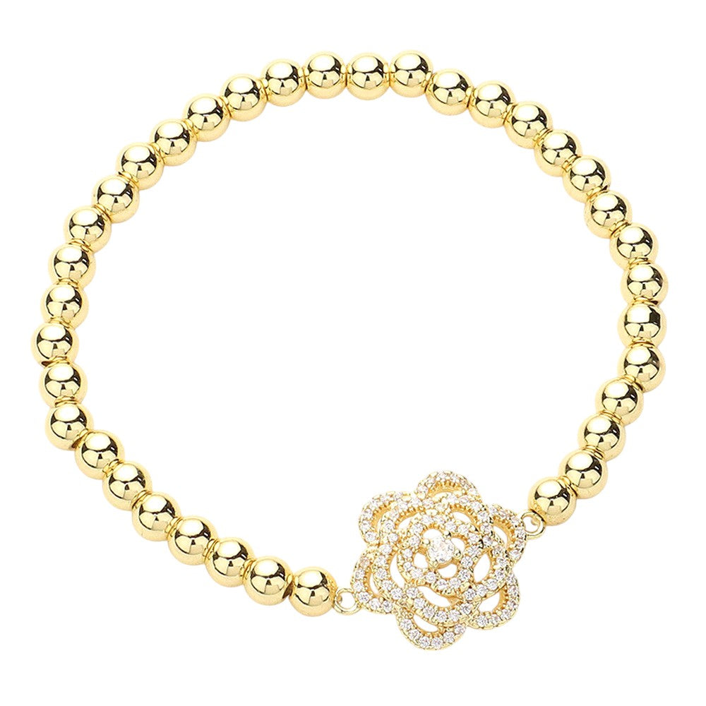 Gold CZ Stone Paved Flower-Pointed Stainless Steel Ball Stretch Bracelet is perfect for adding a touch of elegance to any outfit. The beautiful flower design is adorned with sparkling cubic zirconia stones, making it a must-have accessory for any fashion-forward individual. The stainless steel construction ensures durability, and the stretch design provides a comfortable fit. Elevate your style with this stunning bracelet.