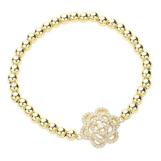 Gold CZ Stone Paved Flower-Pointed Stainless Steel Ball Stretch Bracelet is perfect for adding a touch of elegance to any outfit. The beautiful flower design is adorned with sparkling cubic zirconia stones, making it a must-have accessory for any fashion-forward individual. The stainless steel construction ensures durability, and the stretch design provides a comfortable fit. Elevate your style with this stunning bracelet.