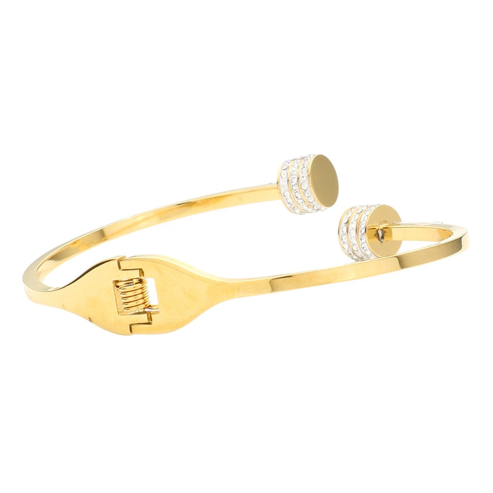 Gold CZ Stone Paved Tip Stainless Steel Hinged Bracelet is a durable and stylish accessory. With its sparkling CZ stones and sturdy stainless steel construction, it adds a touch of elegance to any outfit. The hinged design allows for easy on and off, making it a convenient choice for everyday wear. 