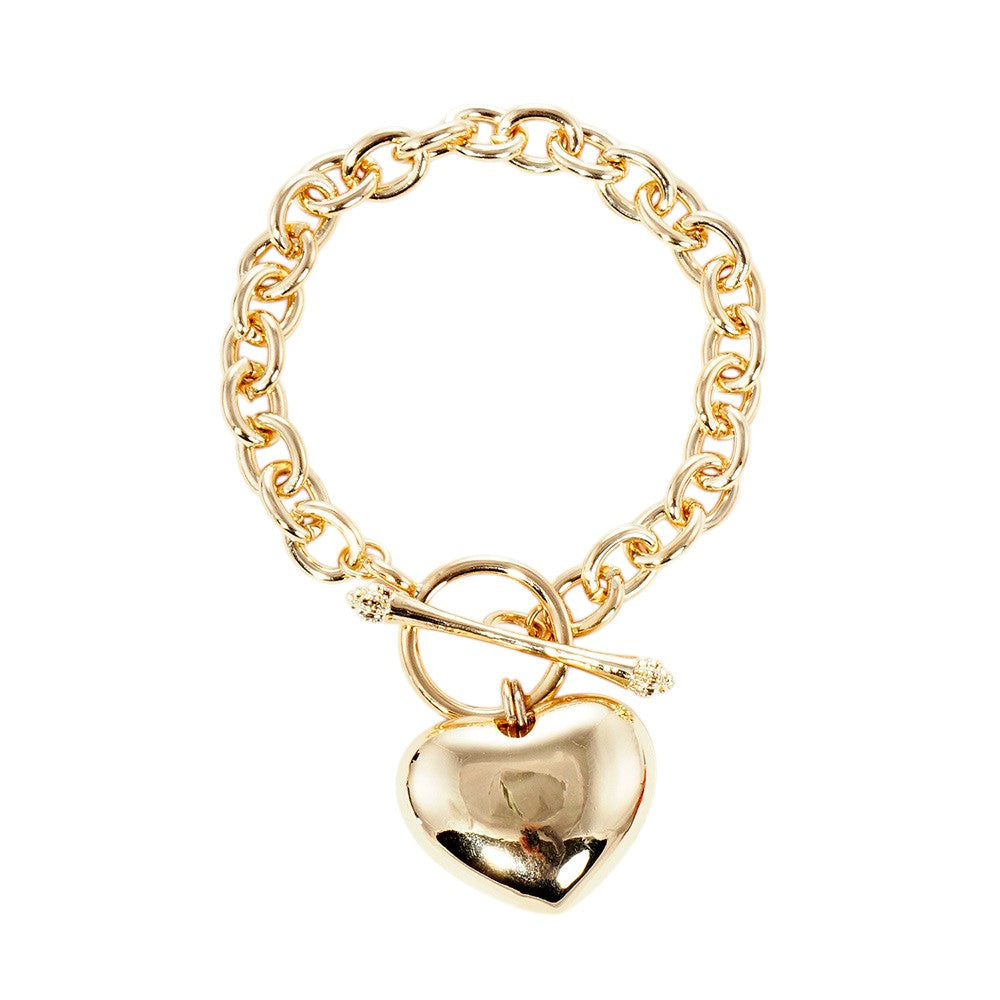 Gold Gold Dipped Metal Heart Charm Toggle Bracelet adds a touch of sophistication to any outfit. Made with high-quality materials, it features a delicate heart charm and a easy-to-use toggle closure. Upgrade your jewelry collection with this timeless piece. 