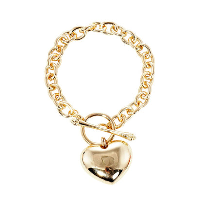 Gold Gold Dipped Metal Heart Charm Toggle Bracelet adds a touch of sophistication to any outfit. Made with high-quality materials, it features a delicate heart charm and a easy-to-use toggle closure. Upgrade your jewelry collection with this timeless piece. 