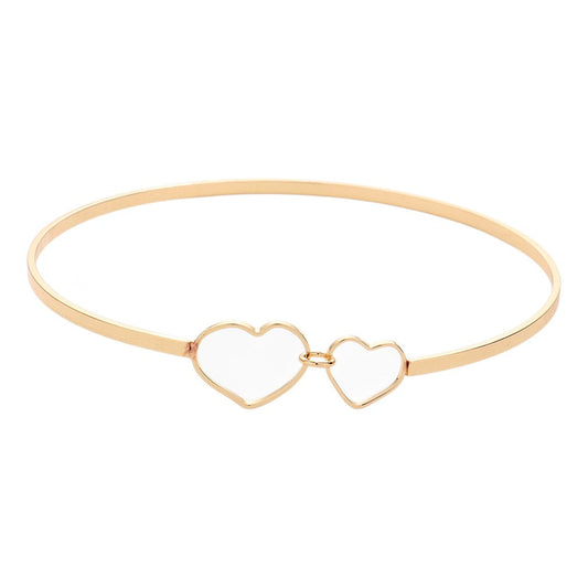 Gold Double Open Metal Heart Link Bangle Bracelet features a unique design that will add a touch of sophistication to any outfit. Made with high-quality metal, it is durable and comfortable to wear. The double open heart link adds a romantic touch, making it the perfect accessory for a date night or special occasion.