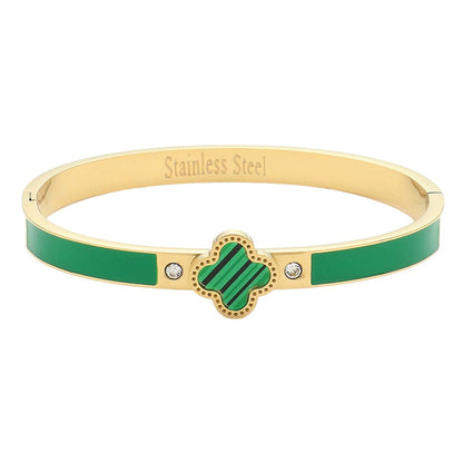 Gold Green Quatrefoil Pointed Stainless Steel Hinged Bracelet is a versatile and durable accessory. With its unique quatrefoil pointed design, it adds an elegant touch to any outfit. Made of high-quality stainless steel, it is both functional and stylish. A perfect choice for fashion-forward individuals.