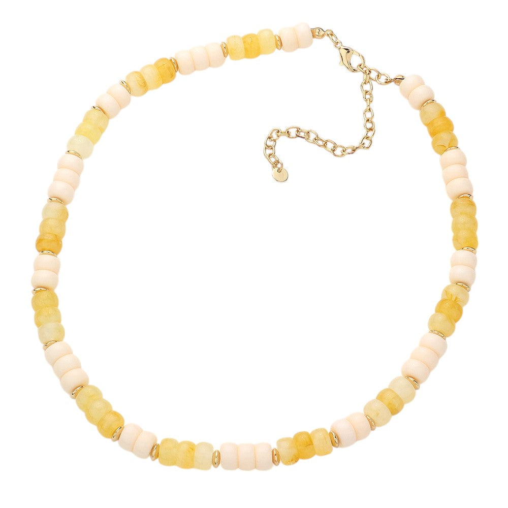 Gold Ivory Chunky Beaded Necklace is a versatile and stylish accessory for any outfit. Made with chunky beads, it adds a touch of elegance and texture to your look. Its bold design makes a statement while being comfortable to wear. Elevate your fashion sense with this eye-catching necklace.