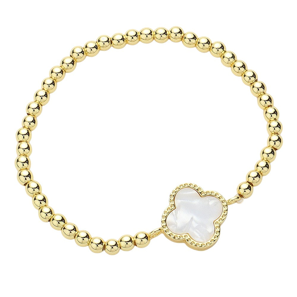 Gold Mother  Of Pearl Quatrefoil Pointed Stainless Steel Ball Beaded Stretch Bracelet is a sleek and modern accessory that adds flair to any outfit. This stretch bracelet is durable and stylish, made with high-quality stainless steel and featuring a trendy quatrefoil pointed design. It is perfect for any fashion-forward individual looking to elevate their style game.