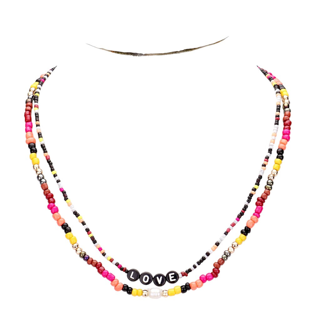 Gold Multi Color Bead Statement Love Layered Necklace adds a pop of color to any outfit! The multi-layered design and vibrant beads create a unique statement piece that is sure to catch attention. Elevate your style with this eye-catching necklace.