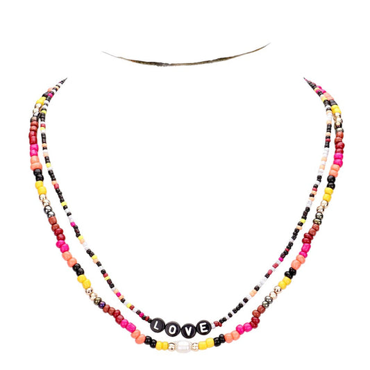Gold Multi Color Bead Statement Love Layered Necklace adds a pop of color to any outfit! The multi-layered design and vibrant beads create a unique statement piece that is sure to catch attention. Elevate your style with this eye-catching necklace.