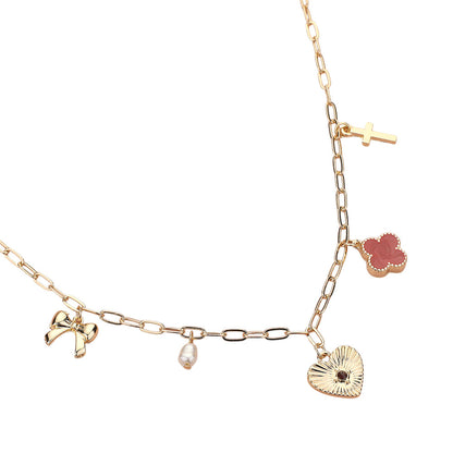 Gold Red Heart Bow Pearl Quatrefoil Cross Charm Station Paperclip Chain Necklace is a timeless addition to any jewelry collection. The delicate details of the heart-shaped charm and pearl quatrefoil cross add a touch of sophistication to any outfit. The sturdy paperclip chain ensures durability and easy wear. Perfect for any occasion, it's a must-have for every fashion-forward individual.