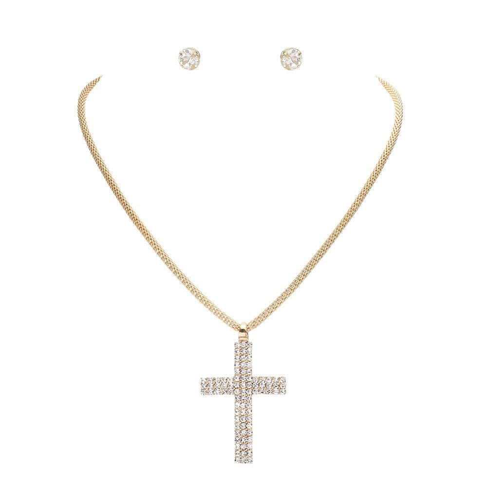 Gold Rhinestone Paved Cross Pendant Jewelry Set is exquisitely crafted from premium-grade metal alloy for a lasting shine. Its intricate design is adorned with shimmering rhinestones for an elegant look. The set includes a matching necklace and earrings. Perfect gift for religious friends and family members.