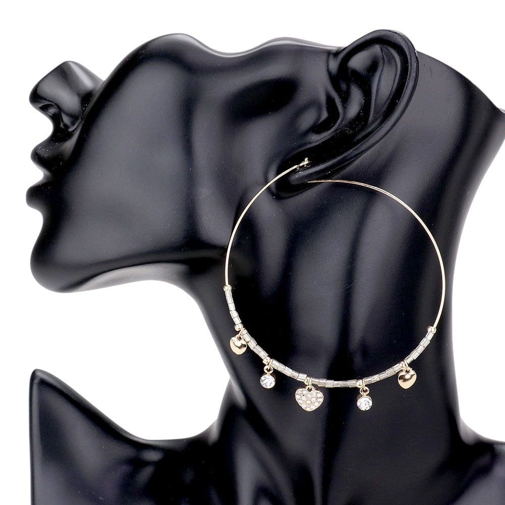 Gold Rhinestone Embellished Metal Heart Beaded Open Circle Earrings add a touch of elegance to any outfit. With intricate rhinestone details and a unique open circle design, these earrings are perfect for any occasion. Made with high-quality materials, these earrings are both stylish and durable. Upgrade your accessory game with these stunning earrings.
