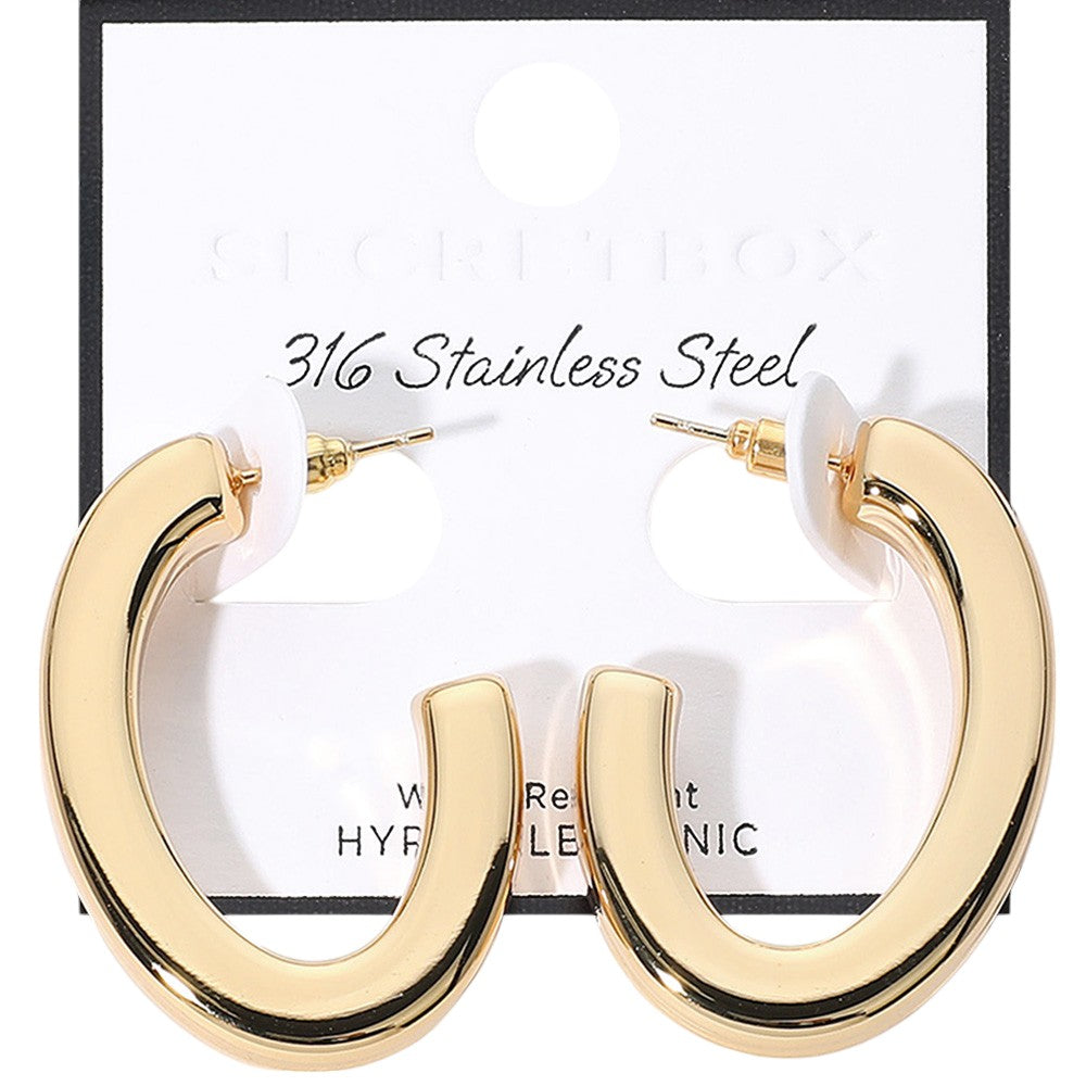 Gold SECRET BOX_Stainless Steel Oval Hoop Earrings are crafted from hypoallergenic stainless steel, making them a safe and comfortable option for everyday wear. Sleek and stylish, their oval shape will add a touch of elegance to any outfit. Expertly designed for long-lasting durability.