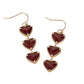 Gold Siam Triple Heart Stone Cluster Link Dropdown Dangle Earrings are a stunning addition to any outfit. Made with three delicate heart-shaped stones, these earrings exude elegance and femininity. The unique link and dropdown design adds a touch of modern sophistication. Perfect for any occasion and a must-have for any jewelry collection.